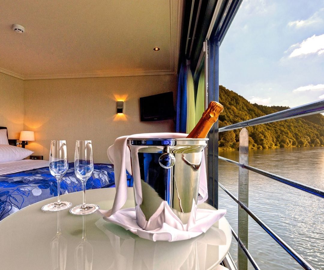 SereniVoy Travel - Ocean cruise luxury suite with wine
